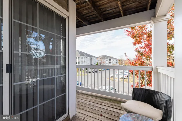 a view of a balcony with furniture