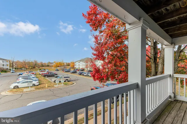 a view of a balcony with wooden floor and outdoor space