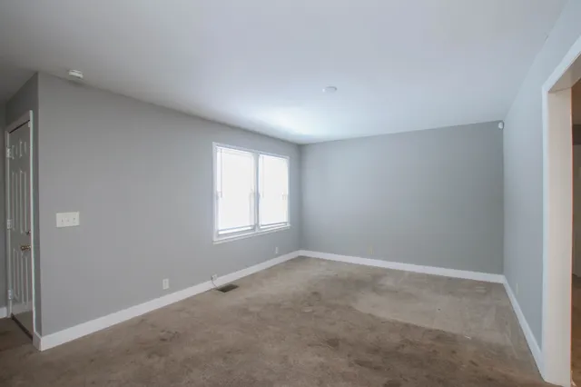 an empty room with windows