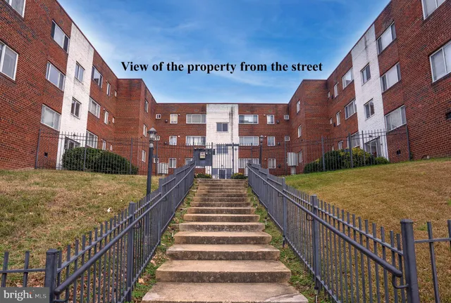 a view of a building with a yard