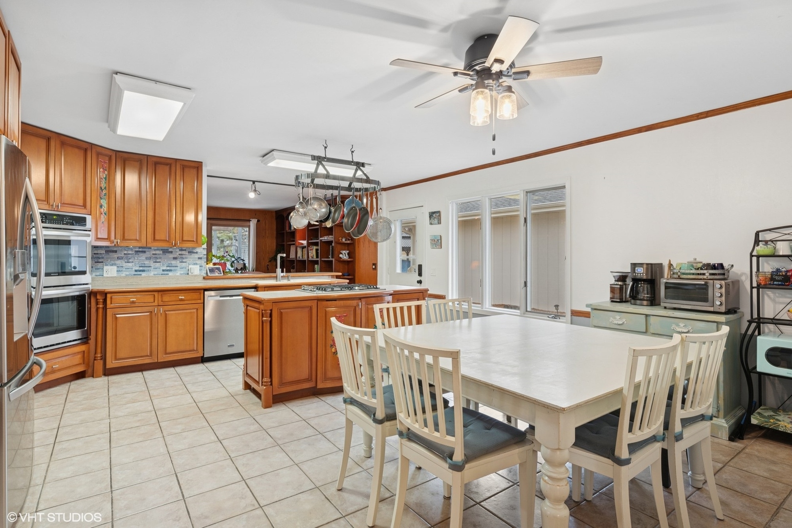 2845 Keystone Road Northbrook, IL 60062 - Photo 7 of 28 a kitchen with stainless steel appliances kitchen island granite countertop a sink a stove counter space and cabinets