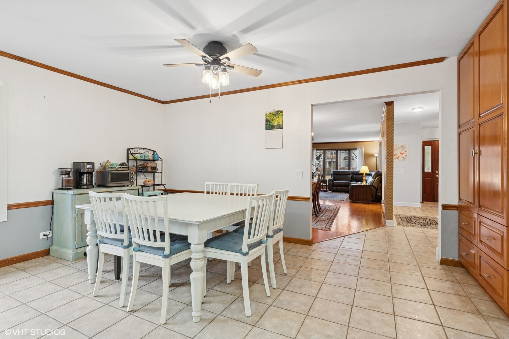 2845 Keystone Road Northbrook, IL 60062 - Photo 8 of 28 a dining room with furniture and a chandelier fan