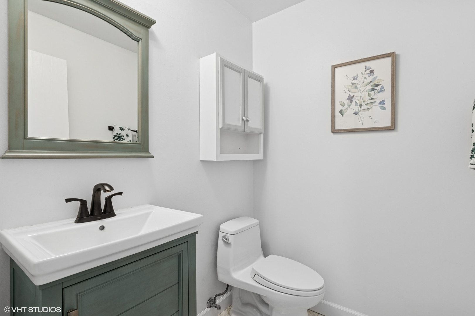 2845 Keystone Road Northbrook, IL 60062 - Photo 9 of 28 a white toilet sitting next to a bathroom sink