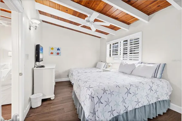 a bedroom with a bed and a dresser