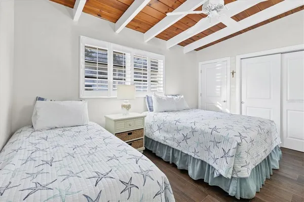 a bedroom with bed and a window