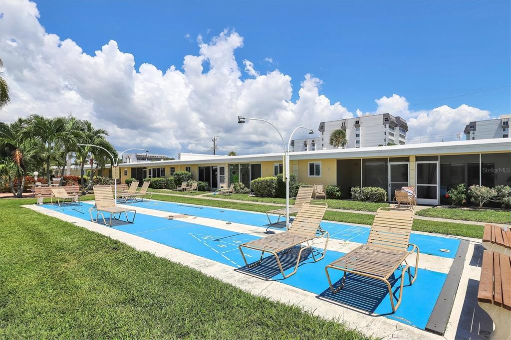 6006 Midnight Pass Road, Unit 15 Sarasota, FL 34242 - Photo 27 of 36 a view of house with outdoor space and swimming pool