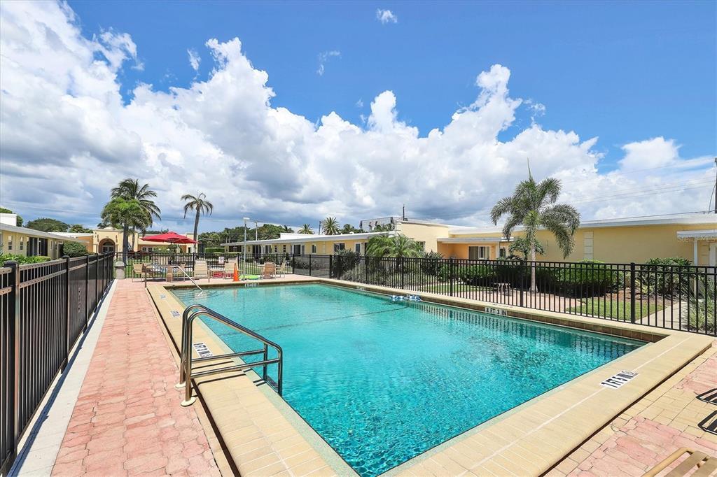 6006 Midnight Pass Road, Unit 15 Sarasota, FL 34242 - Photo 29 of 36 a view of swimming pool