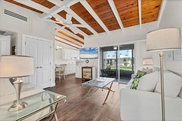 a living room with furniture and fireplace