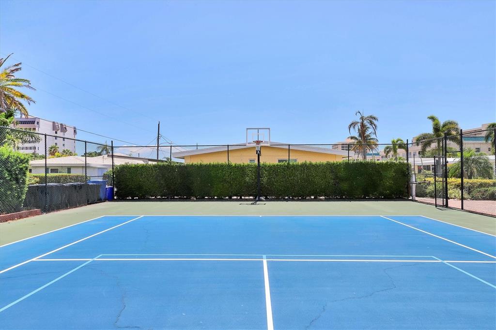 6006 Midnight Pass Road, Unit 15 Sarasota, FL 34242 - Photo 31 of 36 a view of a tennis court