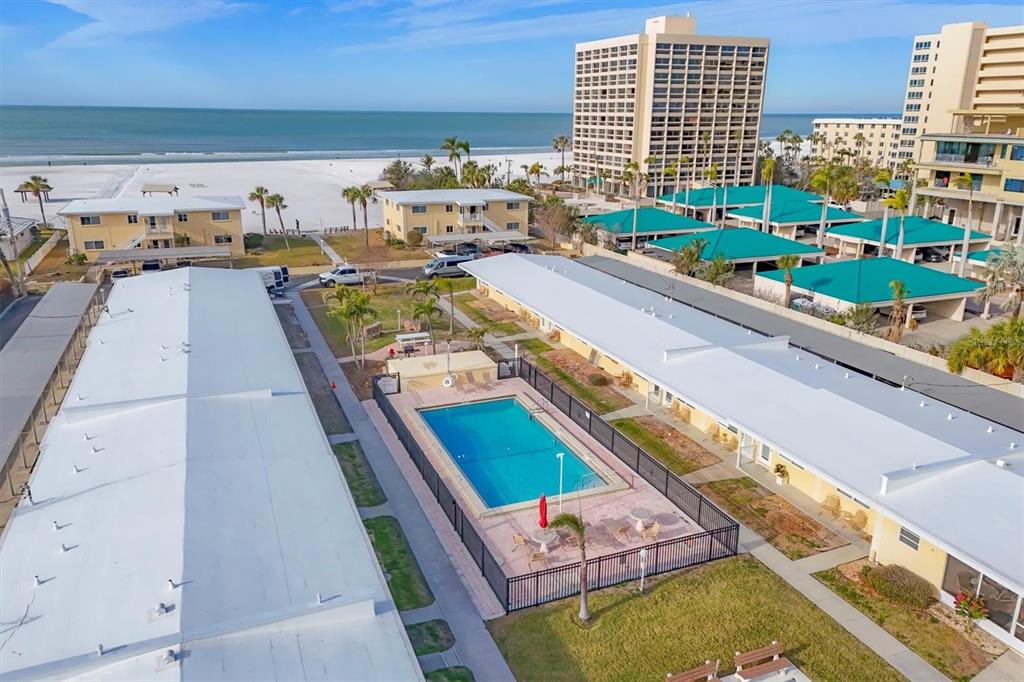 6006 Midnight Pass Road, Unit 15 Sarasota, FL 34242 - Photo 32 of 36 a picture of outdoor space with seating area