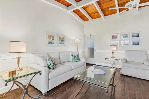 a living room with furniture and a lamp