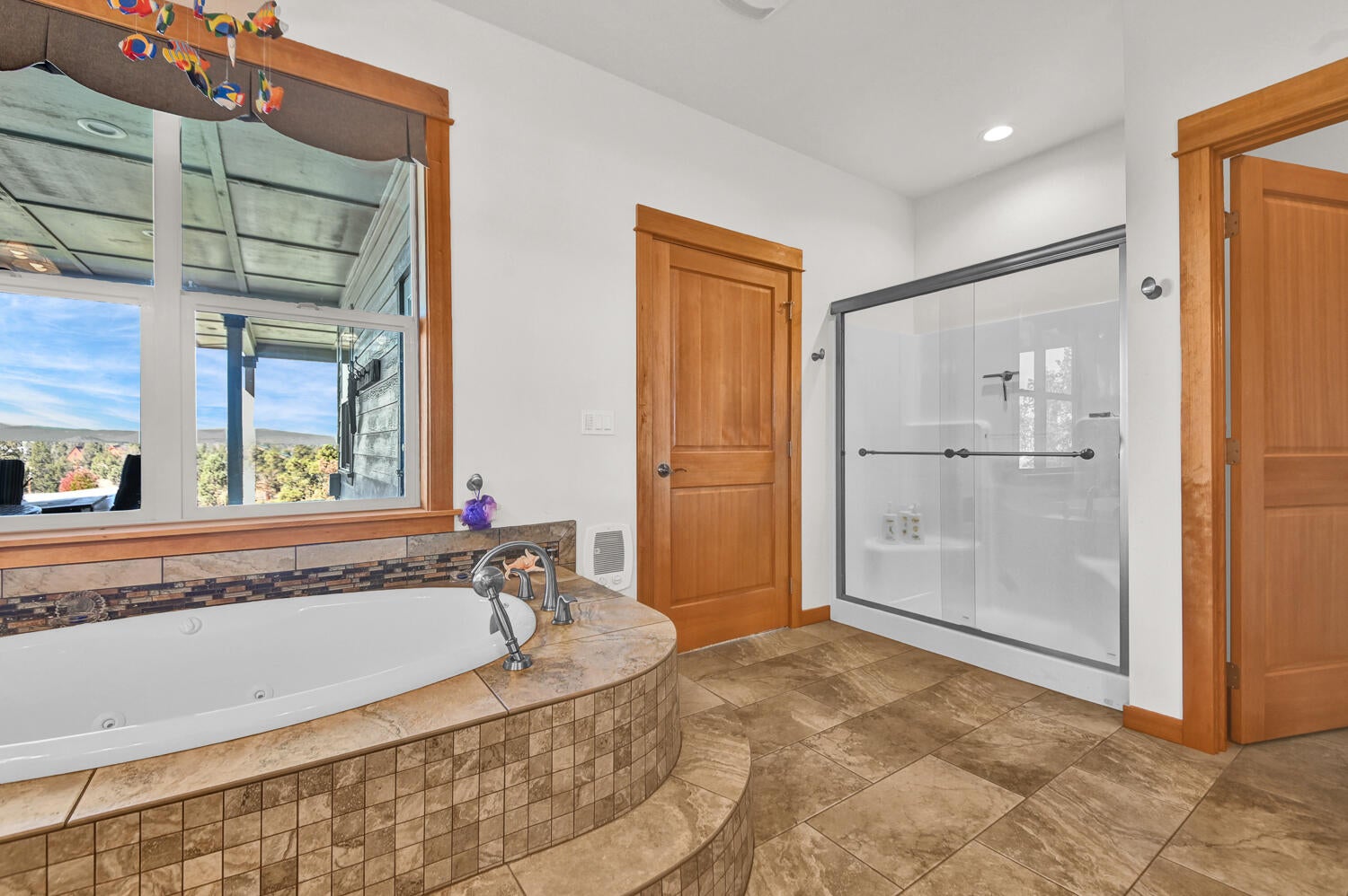 62860 Deschutes Road Bend, OR 97701 - Photo 21 of 34 Tile Accented Jetted Soaking Tub plus a full size shower stall. Separate toilet room.