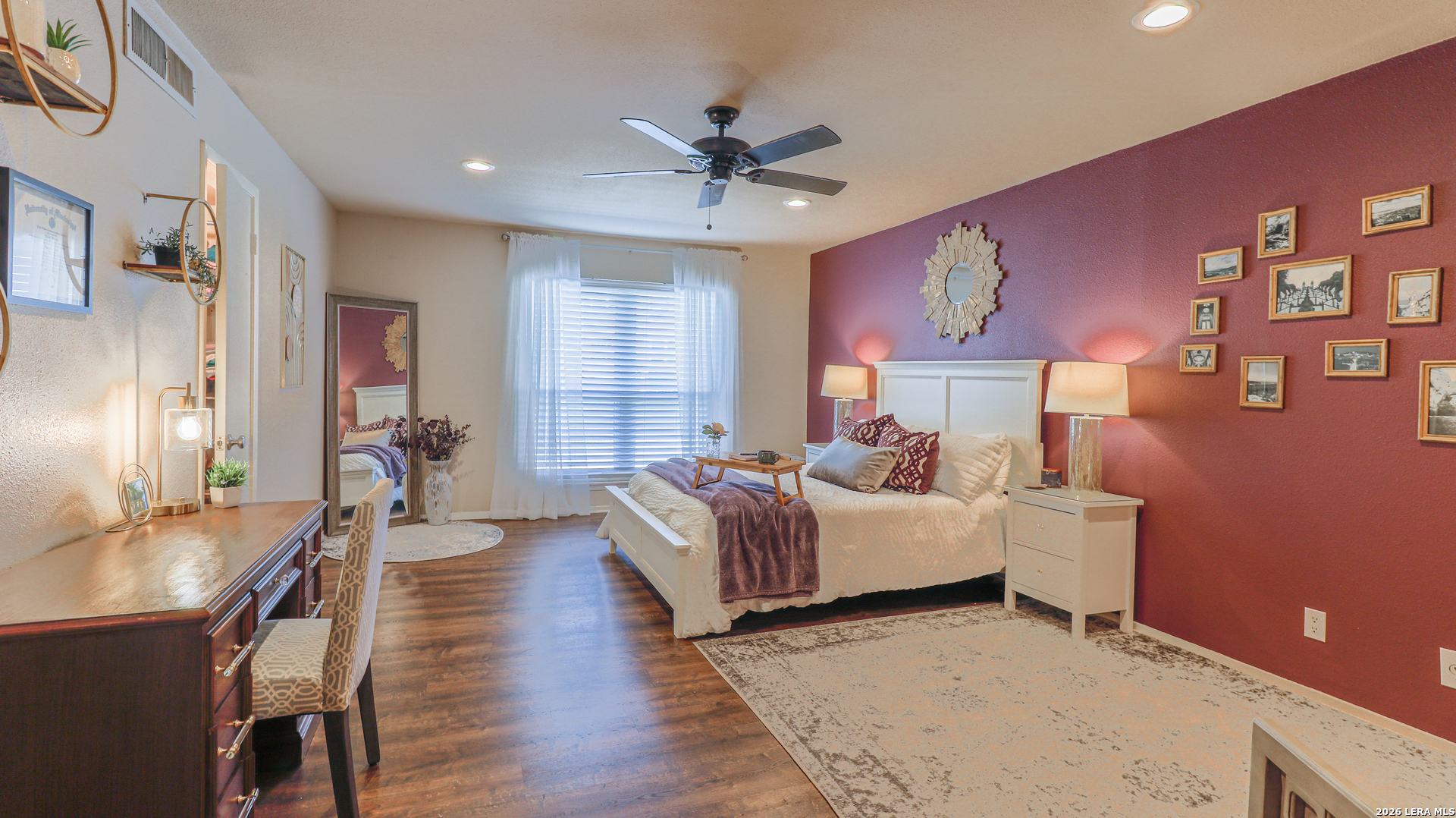 7500 Callaghan Road, Unit 236 San Antonio, TX 78229 - Photo 11 of 19 a bed room with a bed and a chandelier