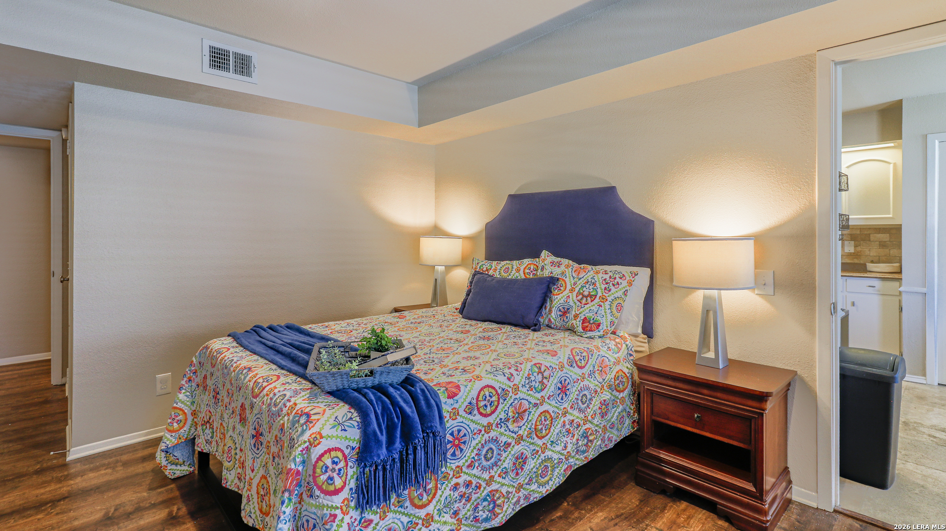 7500 Callaghan Road, Unit 236 San Antonio, TX 78229 - Photo 14 of 19 a bedroom with a bed and a lamp