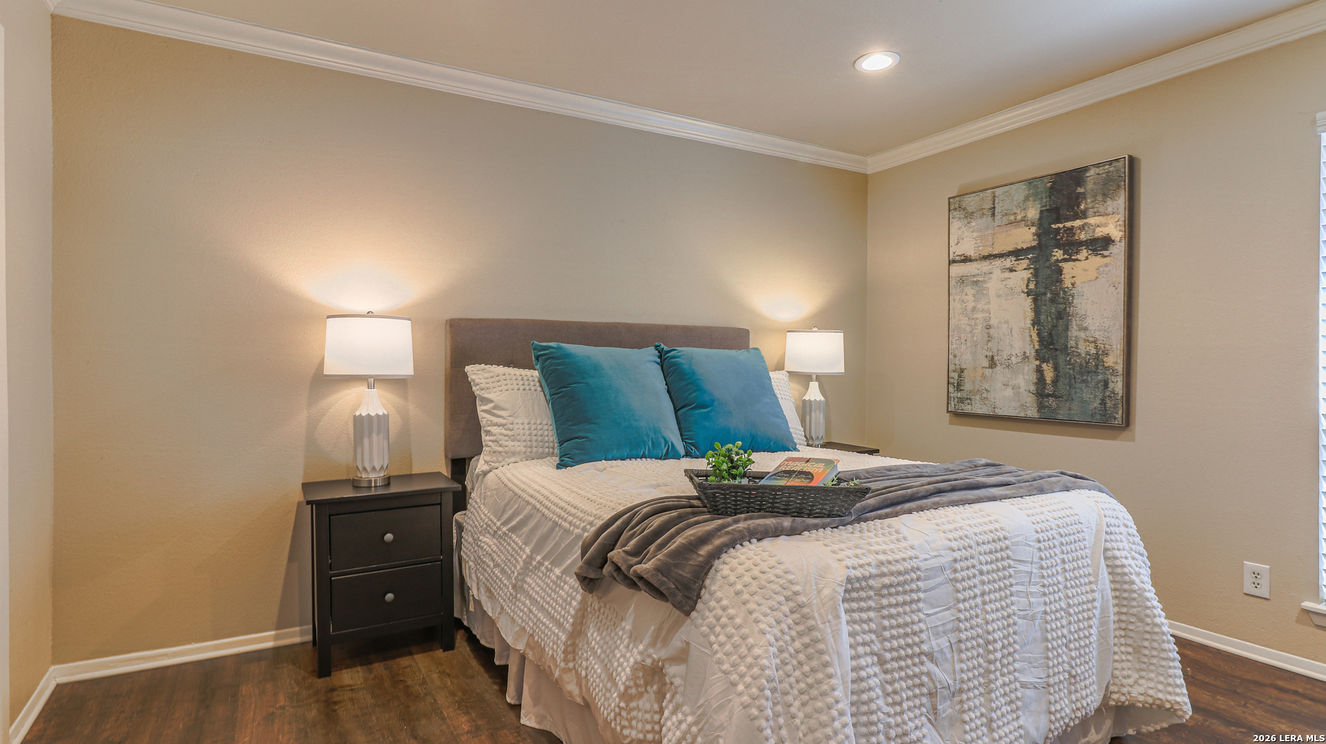 7500 Callaghan Road, Unit 236 San Antonio, TX 78229 - Photo 15 of 19 a bedroom with a bed and wooden floor