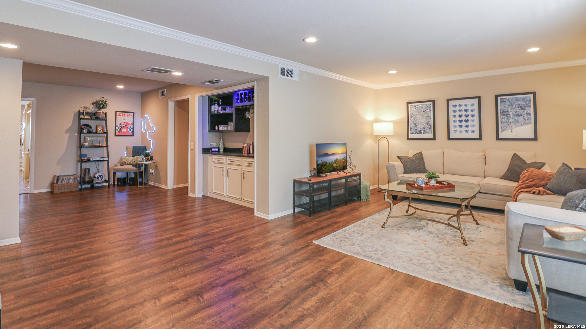 7500 Callaghan Road, Unit 236 San Antonio, TX 78229 - Photo 3 of 19 a living room with furniture and a wooden floor