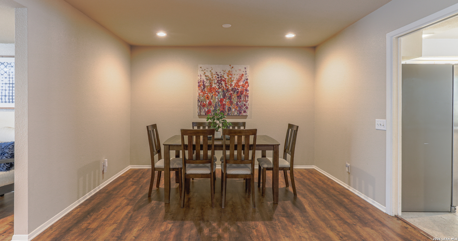 7500 Callaghan Road, Unit 236 San Antonio, TX 78229 - Photo 7 of 19 a view of a dining room with furniture and wooden floor
