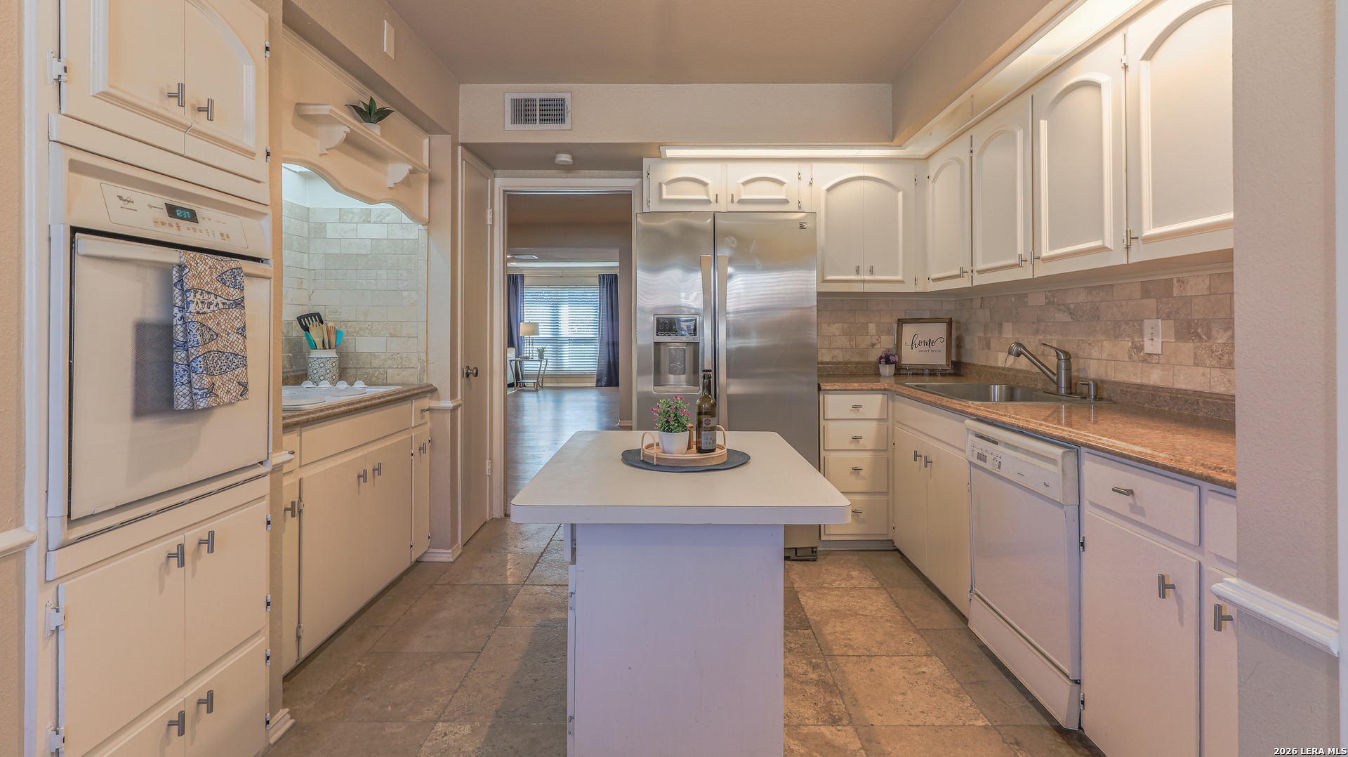 7500 Callaghan Road, Unit 236 San Antonio, TX 78229 - Photo 9 of 19 a kitchen with stainless steel appliances granite countertop a sink and cabinets