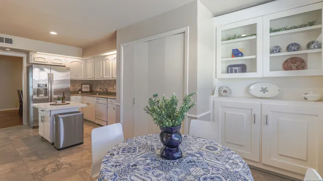 a kitchen with a refrigerator and countertop