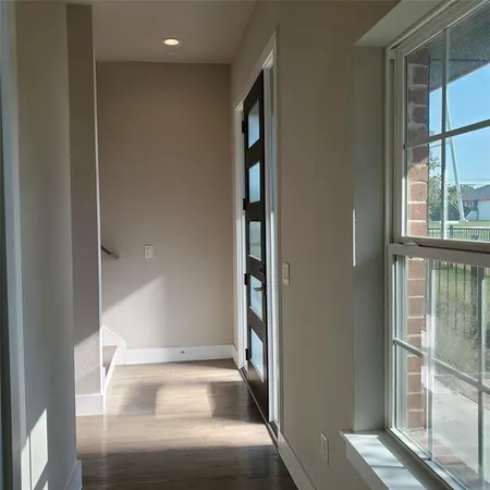 a view of a hallway with windows