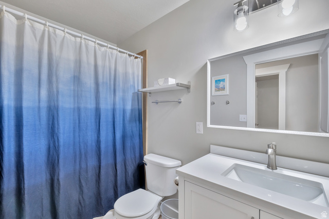 Undisclosed Address Ogden, UT 84403 - Photo 20 of 21 Full bath with vanity and a shower with curtain