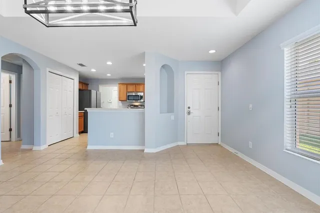 a view of a kitchen with a cabinet and a window