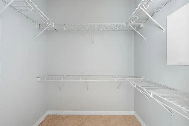 a view of an empty walk in closet