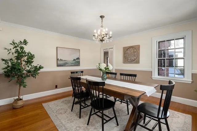 a view of a dining room with furniture and window