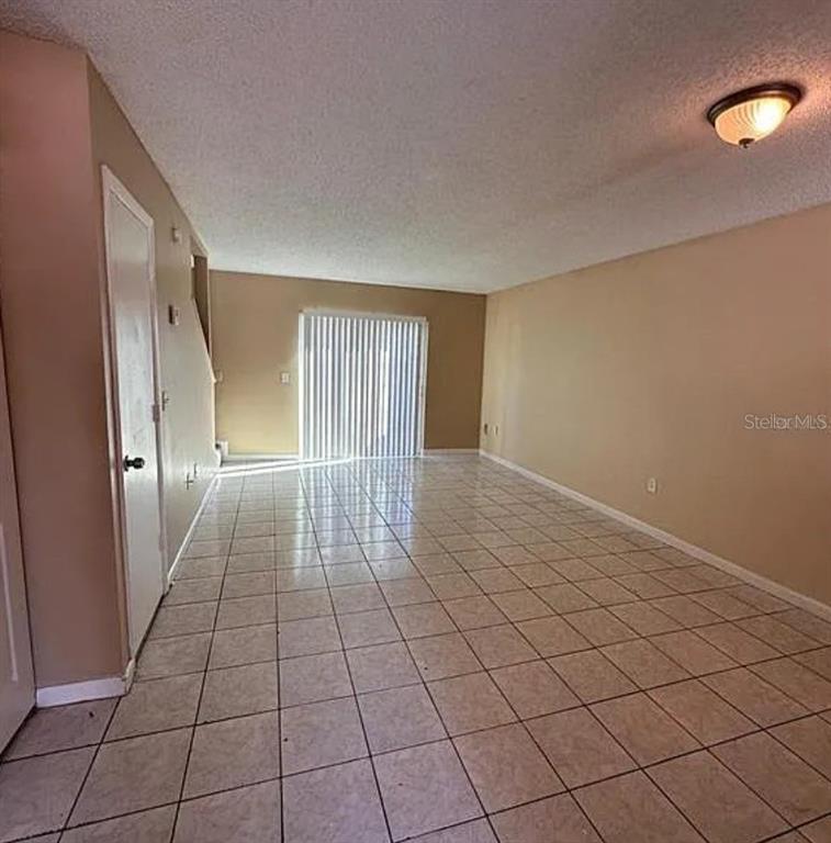 5869 Curry Ford Road Orlando, FL 32822 - Photo 3 of 10 a view of an empty room and window