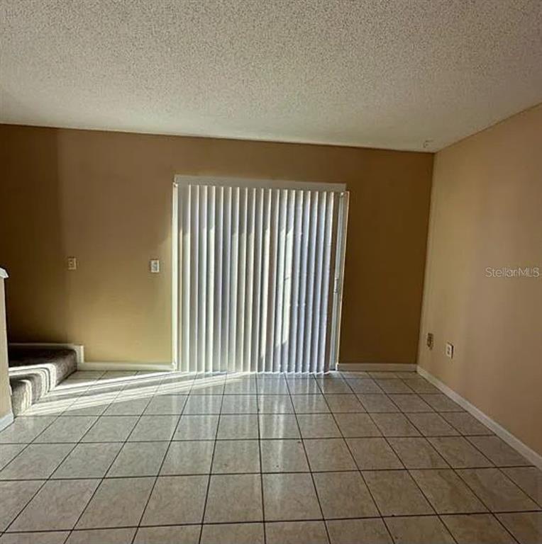 5869 Curry Ford Road Orlando, FL 32822 - Photo 4 of 10 a view of an empty room