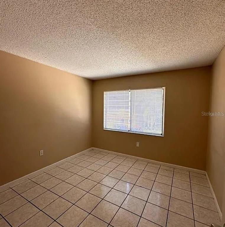 5869 Curry Ford Road Orlando, FL 32822 - Photo 5 of 10 a view of an empty room and window