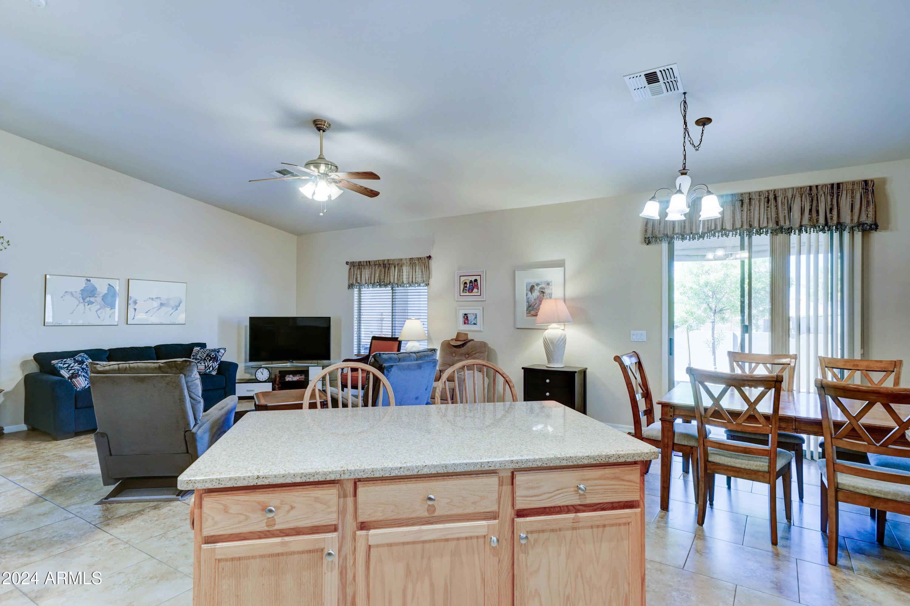 2101 South Meridian Road, Unit 126 Apache Junction, AZ 85120 - Photo 11 of 58 a view of a dining room with furniture window and wooden floor