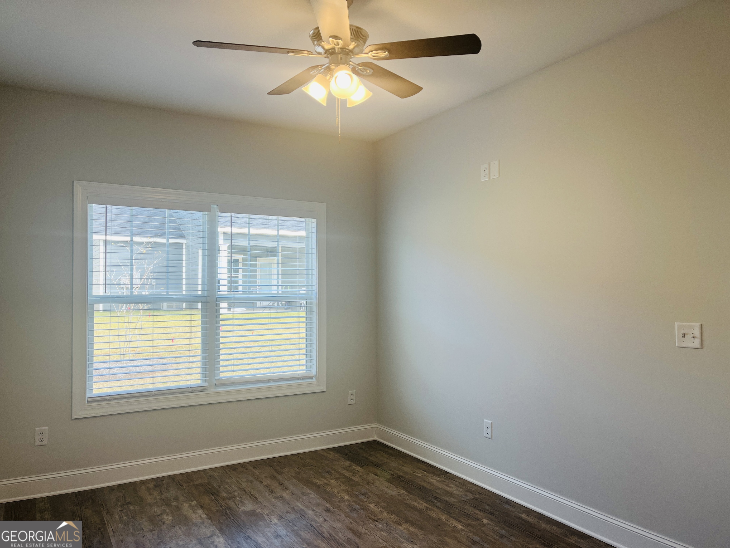 110 Lenox Circle LaGrange, GA 30241 - Photo 13 of 23 an empty room with a window and a fan