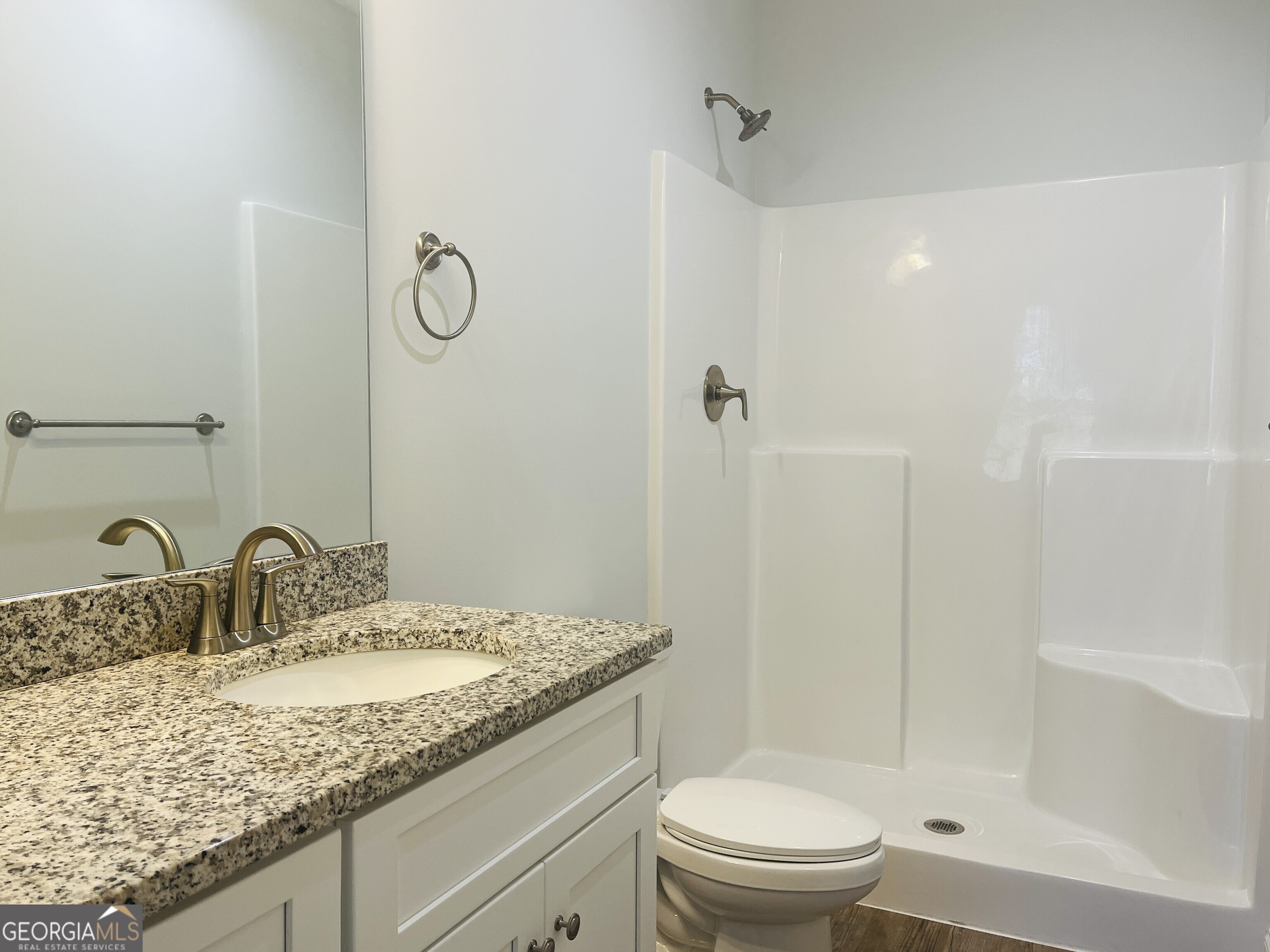 110 Lenox Circle LaGrange, GA 30241 - Photo 15 of 23 a bathroom with a granite countertop sink a toilet and shower