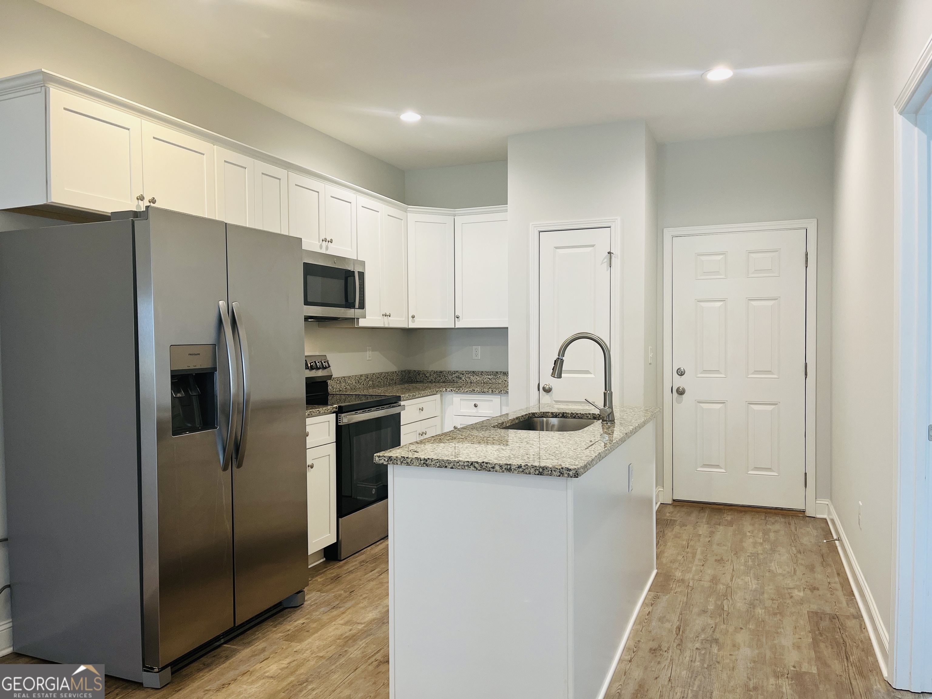 110 Lenox Circle LaGrange, GA 30241 - Photo 4 of 23 a kitchen with stainless steel appliances granite countertop a refrigerator and a stove top oven