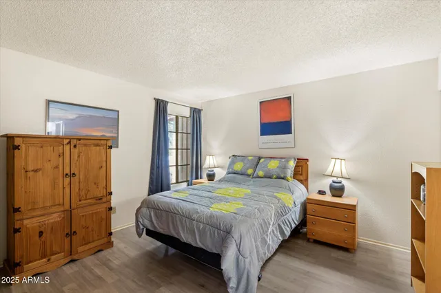 a bedroom with a bed and a closet