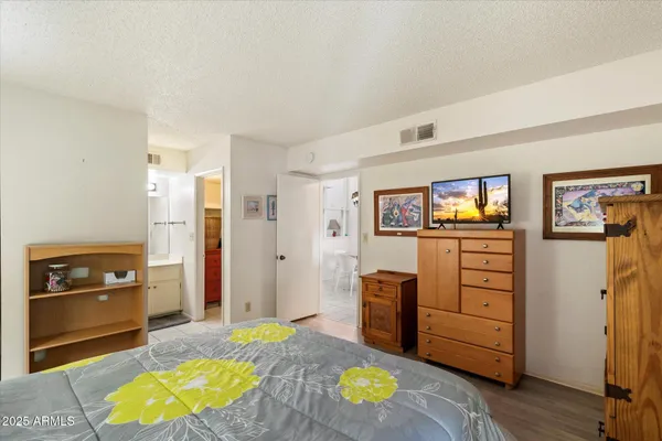 a view of living room with furniture and wooden floor