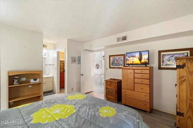 a view of living room with furniture and wooden floor