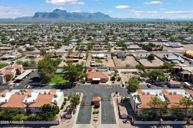 an aerial view of residential houses with outdoor space