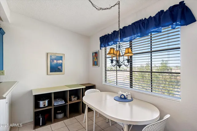 a view of a dining room with furniture and window