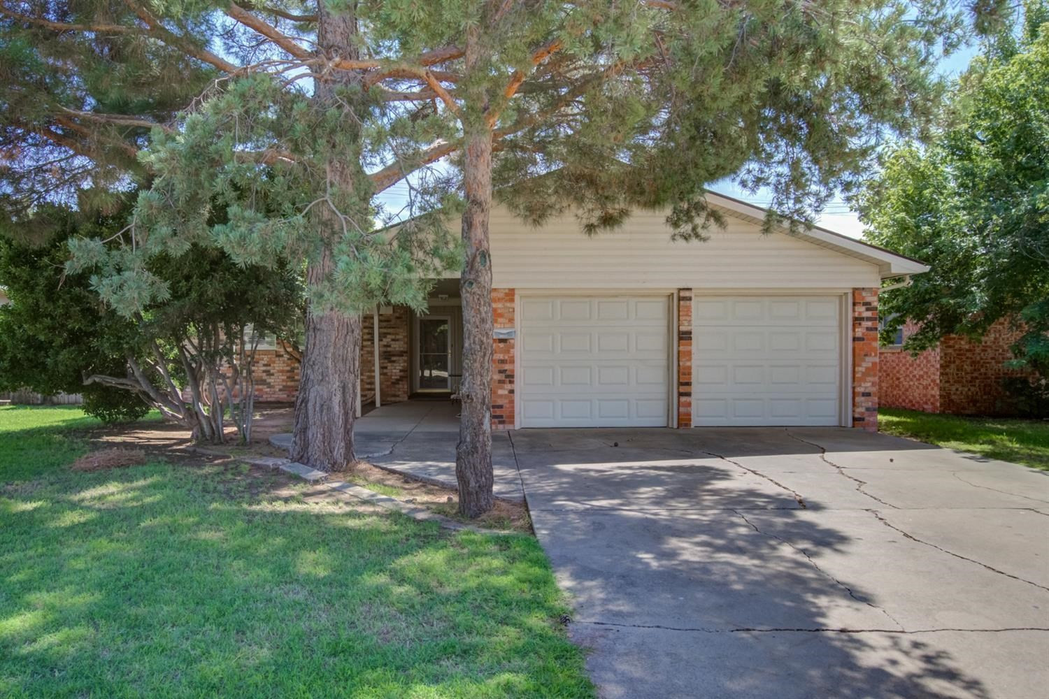 5427 46th Street Lubbock, TX 79414 - Photo 1 of 38 a front view of house with yard