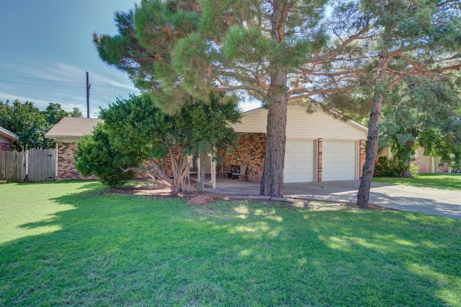5427 46th Street Lubbock, TX 79414 - Photo 2 of 38 a view of a house with a yard and sitting area