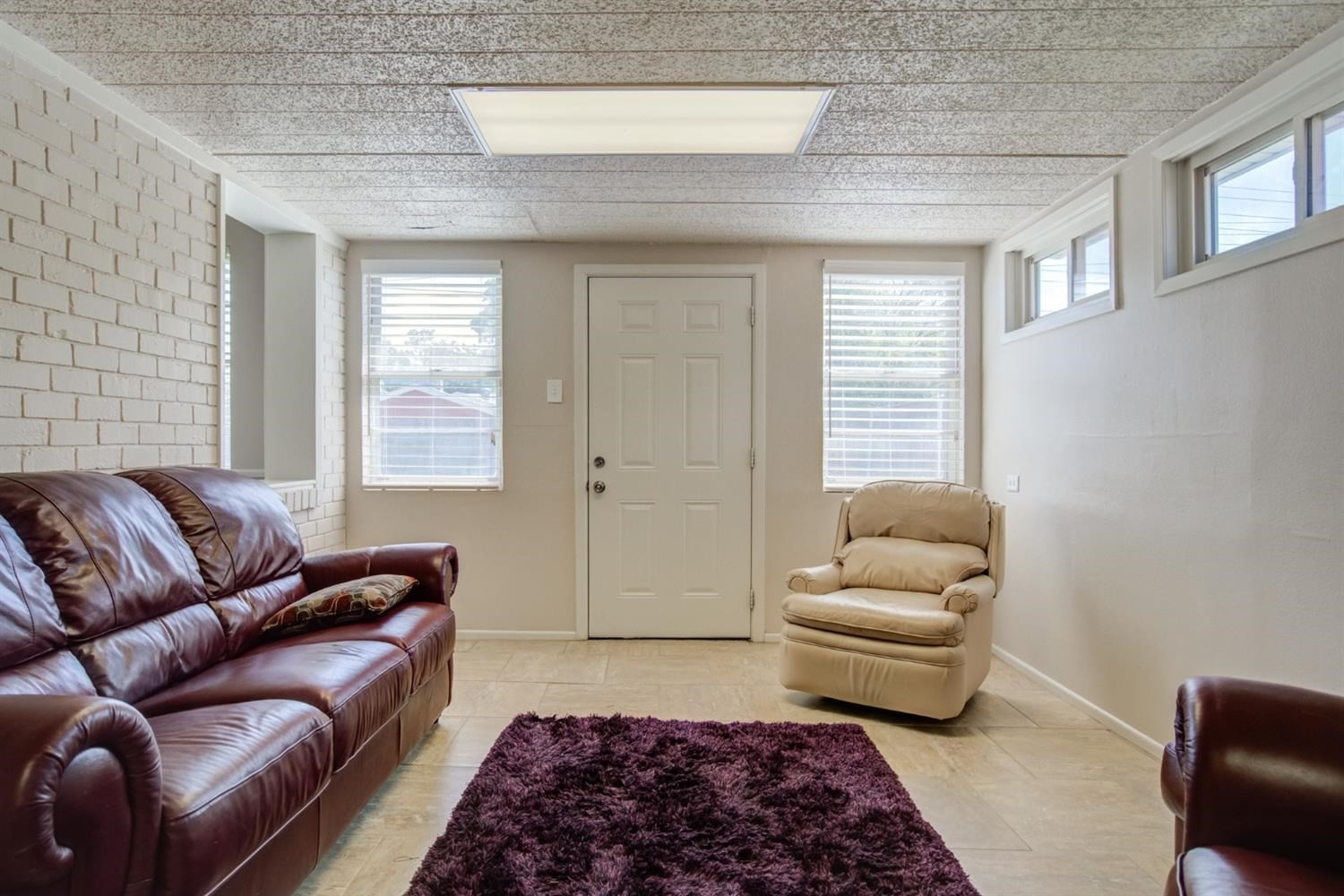 5427 46th Street Lubbock, TX 79414 - Photo 24 of 38 a living room with furniture and a rug