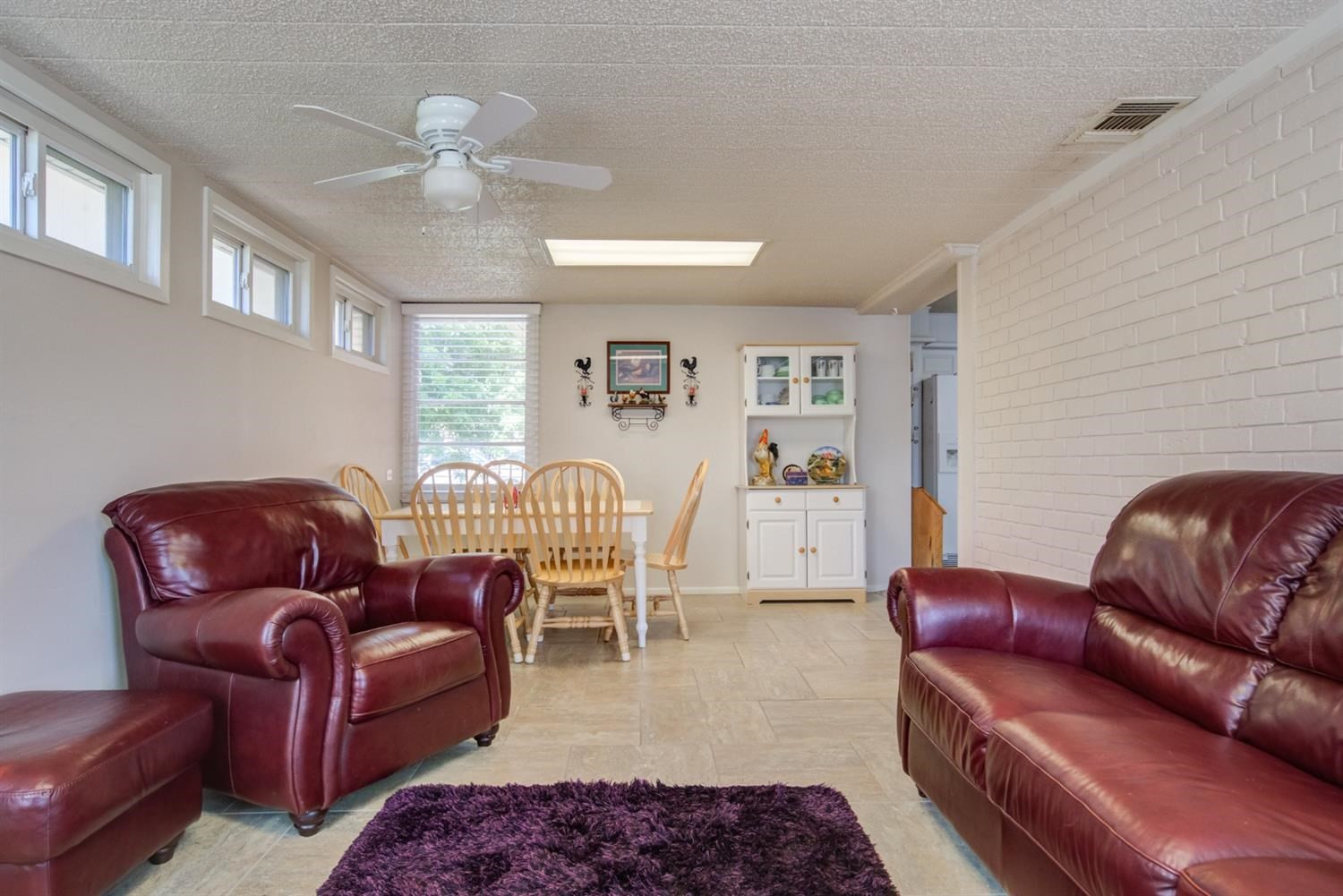 5427 46th Street Lubbock, TX 79414 - Photo 25 of 38 a living room with furniture ceiling fan and a rug
