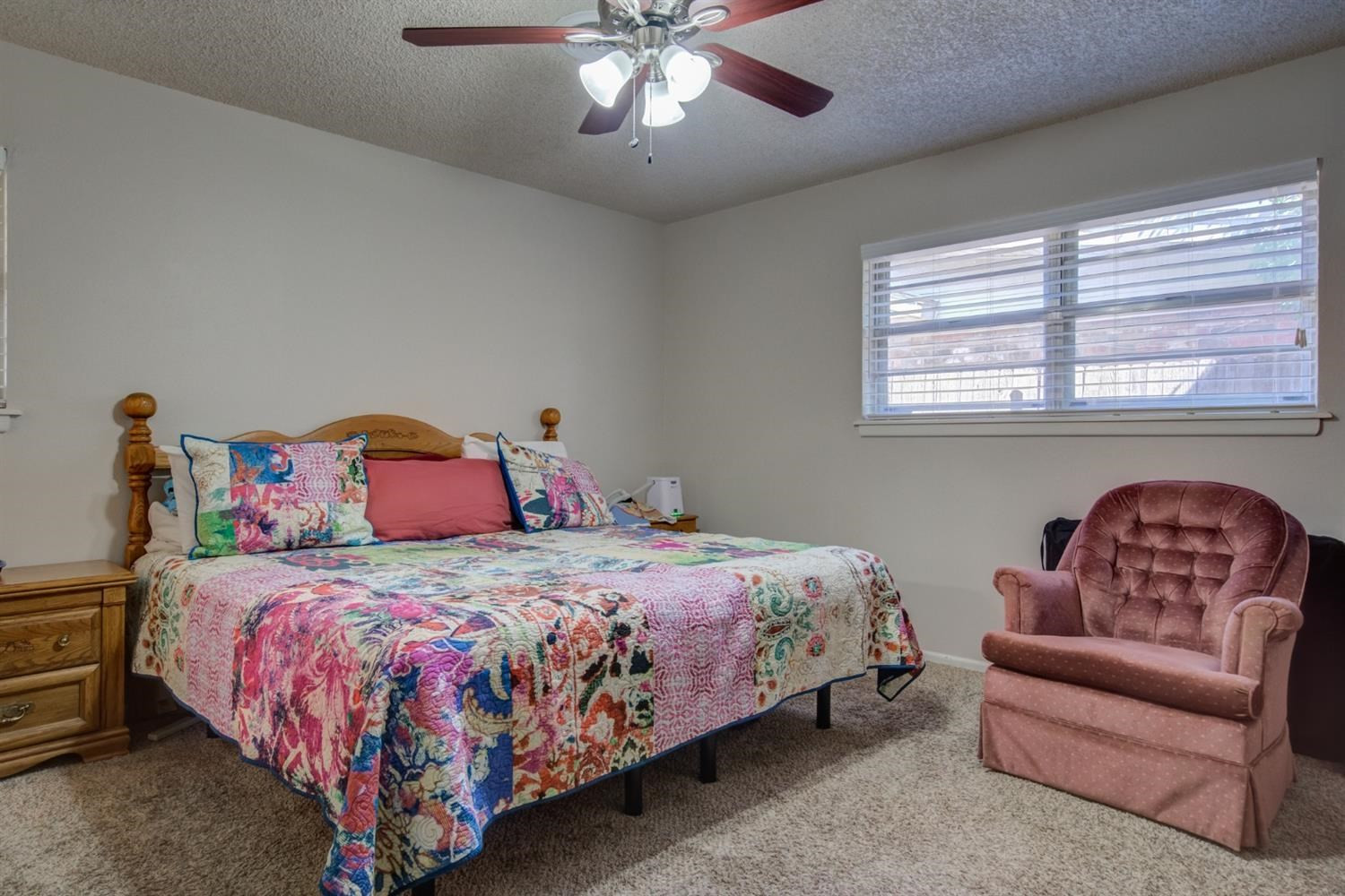 5427 46th Street Lubbock, TX 79414 - Photo 26 of 38 a bedroom with a bed couch and window