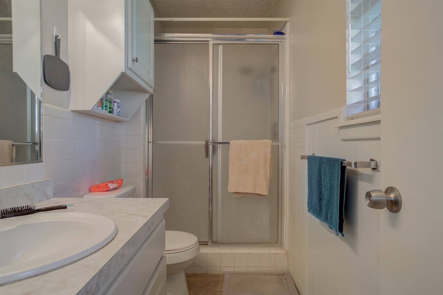 5427 46th Street Lubbock, TX 79414 - Photo 28 of 38 a bathroom with a sink toilet and shower
