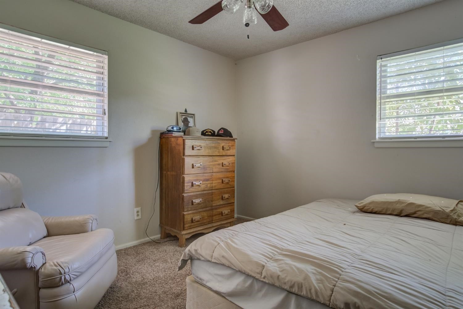 5427 46th Street Lubbock, TX 79414 - Photo 32 of 38 a bedroom with a bed and furniture