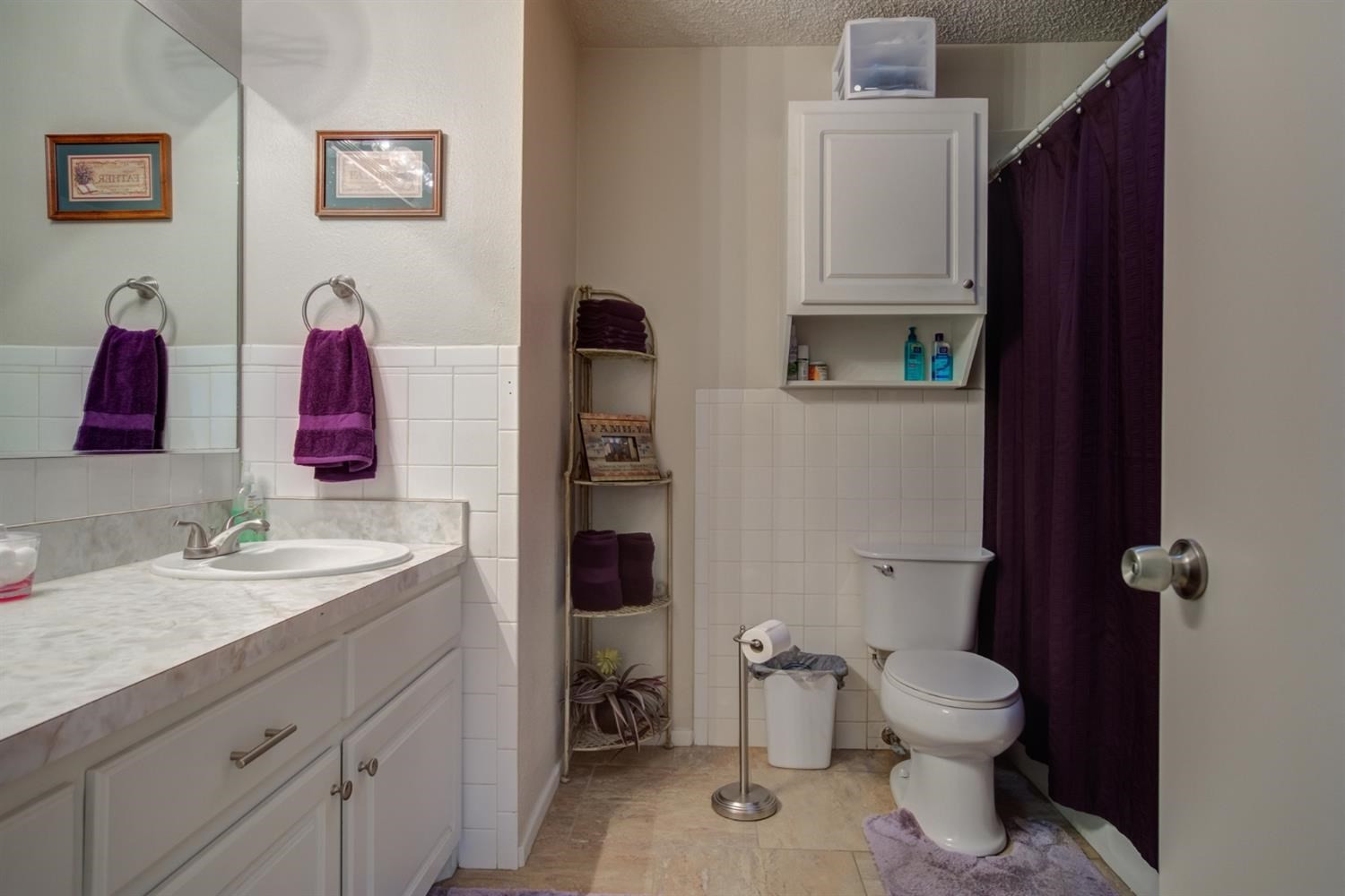 5427 46th Street Lubbock, TX 79414 - Photo 33 of 38 a bathroom with a sink vanity mirror and toilet