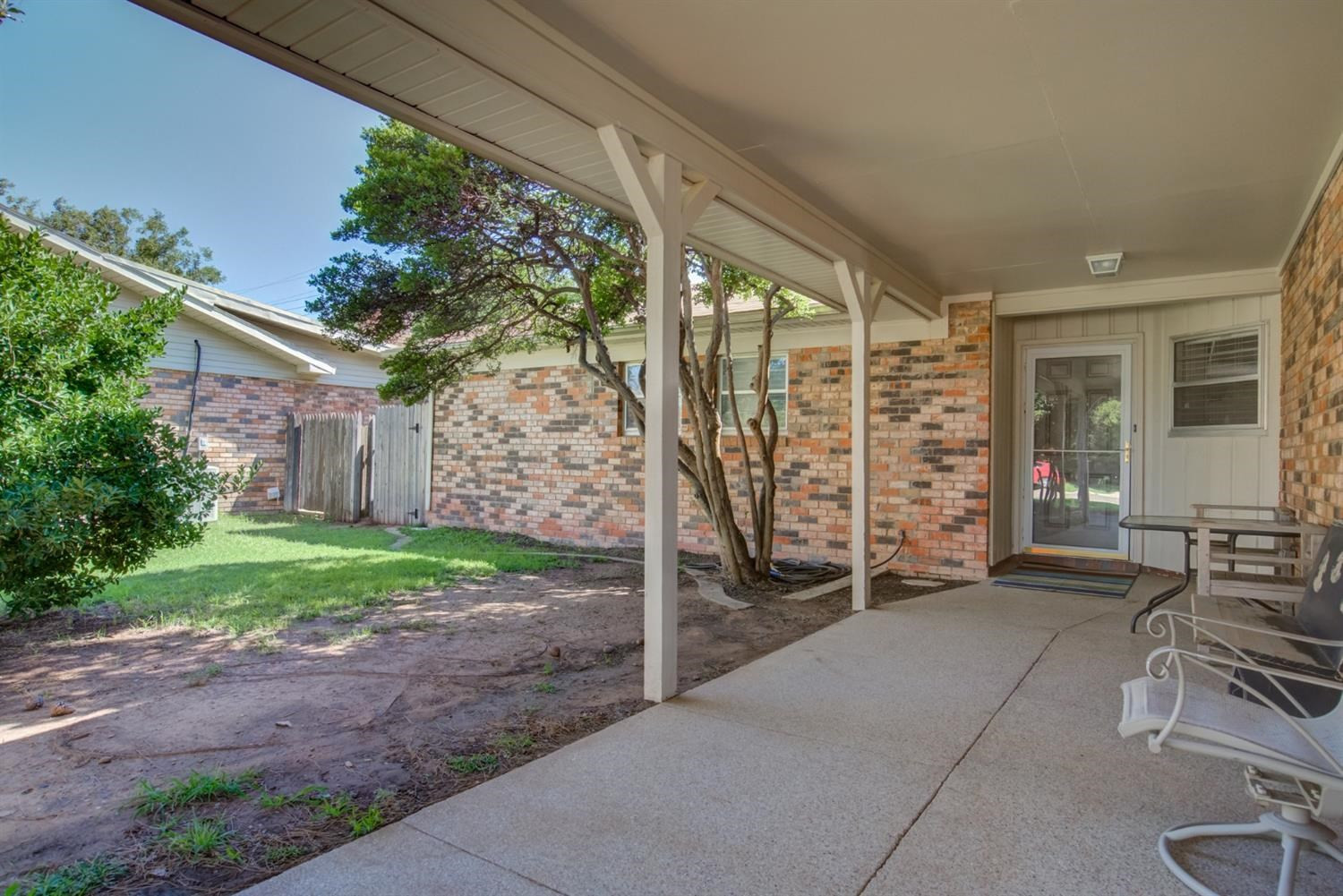 5427 46th Street Lubbock, TX 79414 - Photo 4 of 38 a view of a patio with table and chairs and potted plants