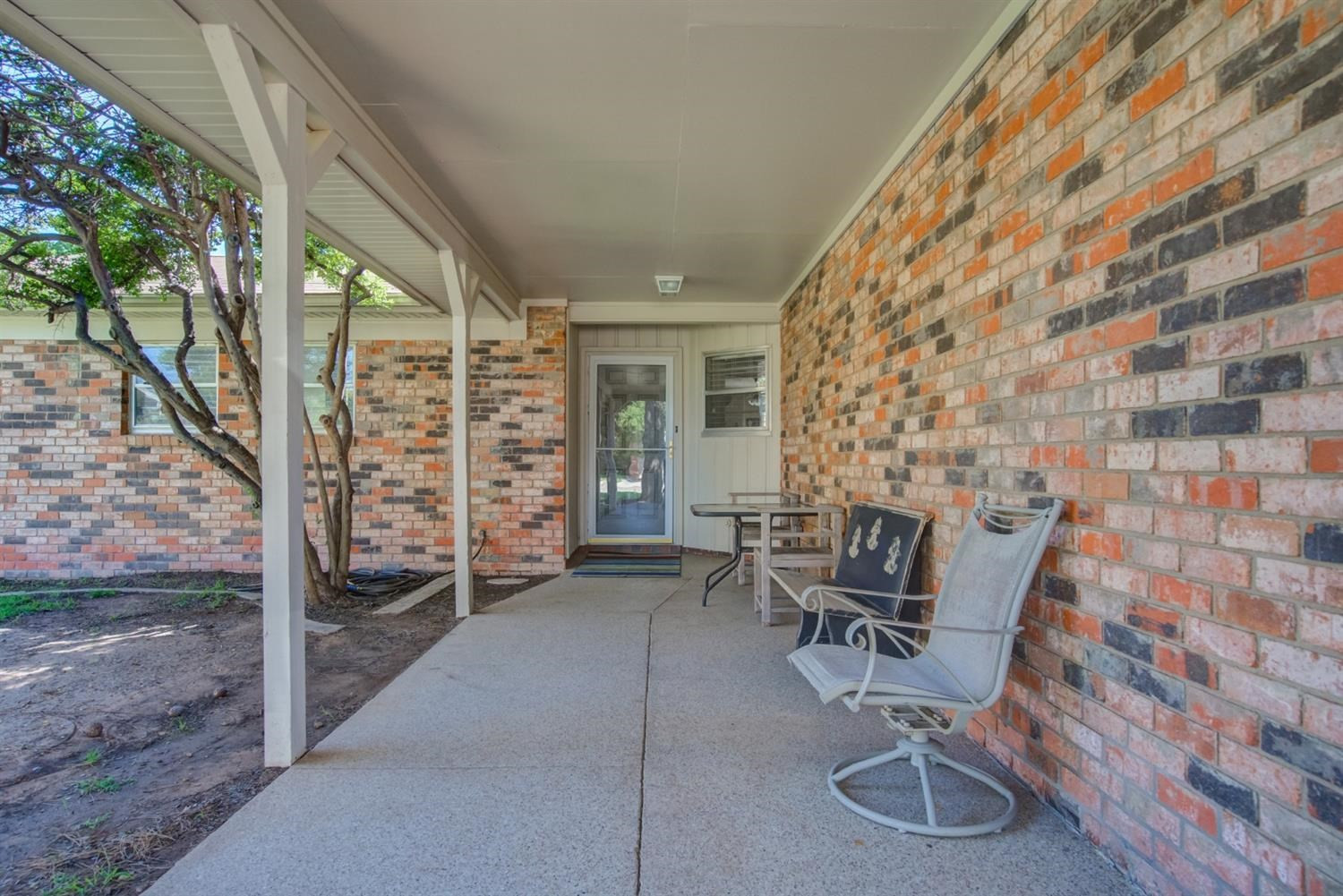 5427 46th Street Lubbock, TX 79414 - Photo 5 of 38 a view of patio with table and chairs and potted plants